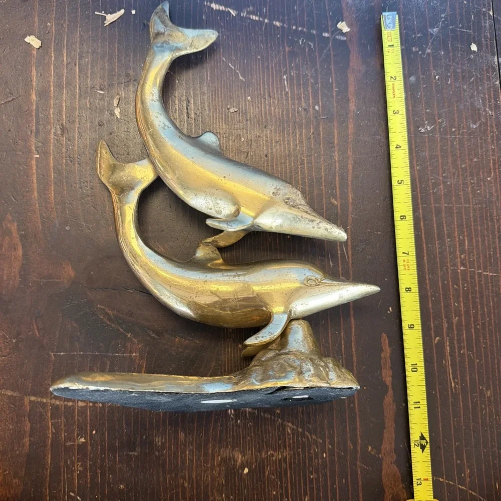 brass dolphin sculpture